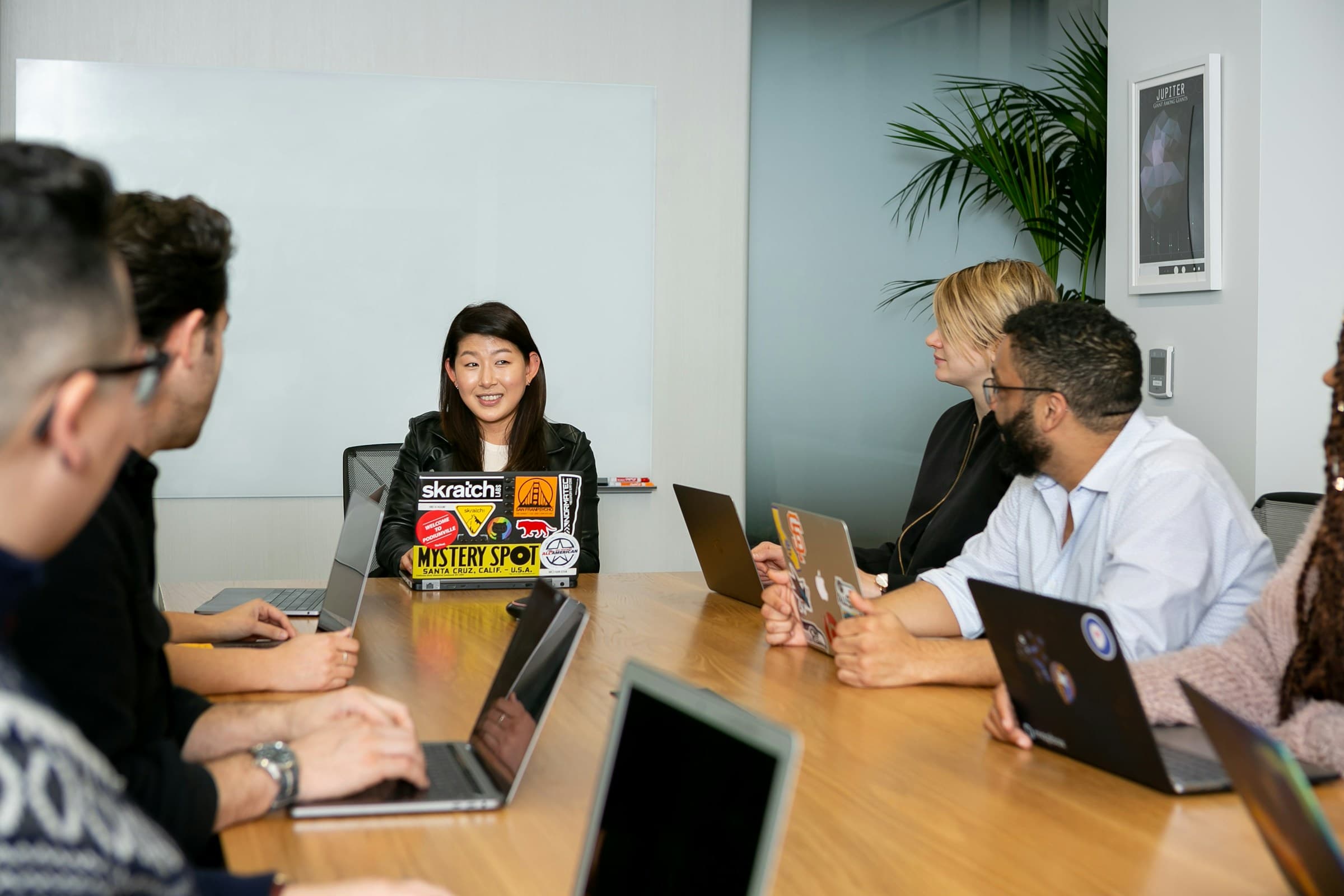 Rooly team co-building with clients in a meeting room