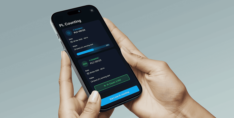 Hand holding a phone showing the AquaVision PL Counting screen
